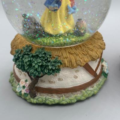 LOT: 144B: Disney x Enesco Waltz Of The Flowers & Listen To The Mocking Bird Musical Snow Globes