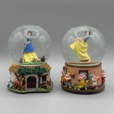LOT: 144B: Disney x Enesco Waltz Of The Flowers & Listen To The Mocking Bird Musical Snow Globes