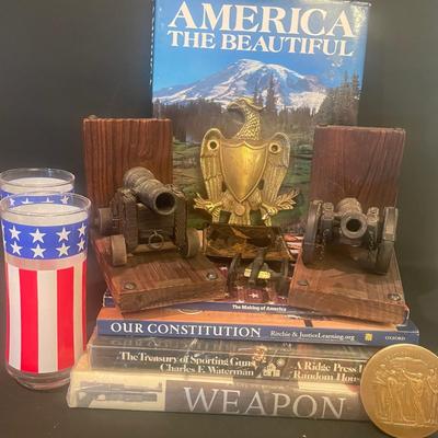 LOT; 1 Rustic Wooden Bookends with Cannon Repllcas, Brass Eagle Medallion, Stars and Stripes Drinking Glasses, Variety of Coffee Table...