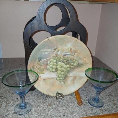 Nice wooden wine rack with wine themed plate and two stemmed glasses