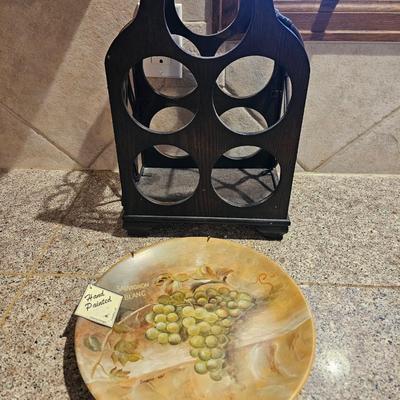 Nice wooden wine rack with wine themed plate and two stemmed glasses