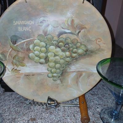 Nice wooden wine rack with wine themed plate and two stemmed glasses