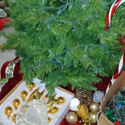 Large faux Christmas tree with skirt, ornaments, greenery, Angel, lights and more !