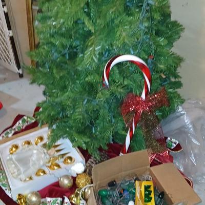 Large faux Christmas tree with skirt, ornaments, greenery, Angel, lights and more !