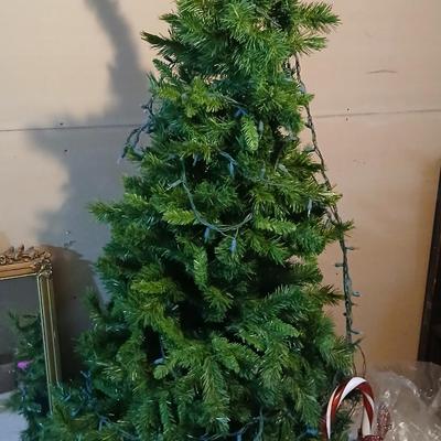 Large faux Christmas tree with skirt, ornaments, greenery, Angel, lights and more !