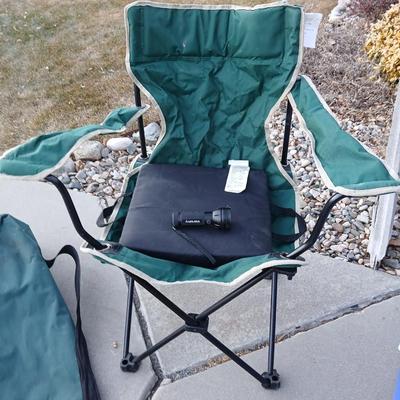Folding camping chair with clean Igloo cooler on wheels