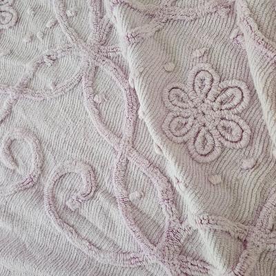 Three wedge pillows with a Chenille Bedspread