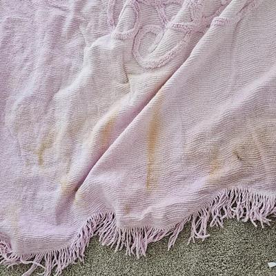 Three wedge pillows with a Chenille Bedspread