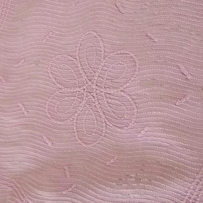 Three wedge pillows with a Chenille Bedspread