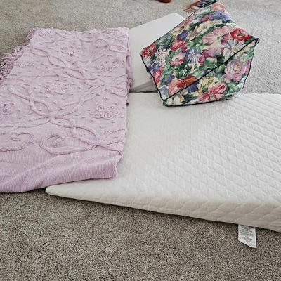 Three wedge pillows with a Chenille Bedspread