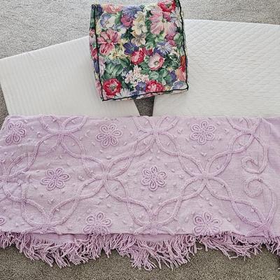 Three wedge pillows with a Chenille Bedspread