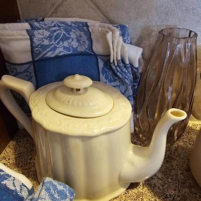 Tea pot with porcelain napkin rings - linens and an assortment of crock like dishware