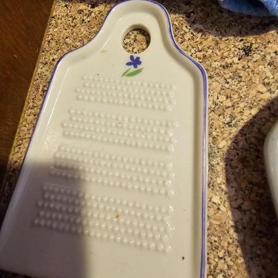 Tea pot with porcelain napkin rings - linens and an assortment of crock like dishware