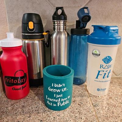 Stainless drink vessels = plastic drink cups and a koozie