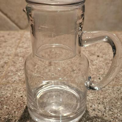 Hamilton Beach drink mixer with an assortment of shot glasses and more