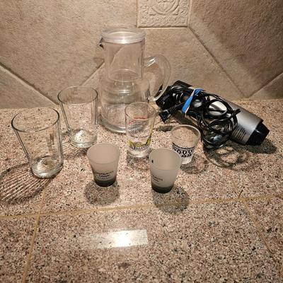 Hamilton Beach drink mixer with an assortment of shot glasses and more