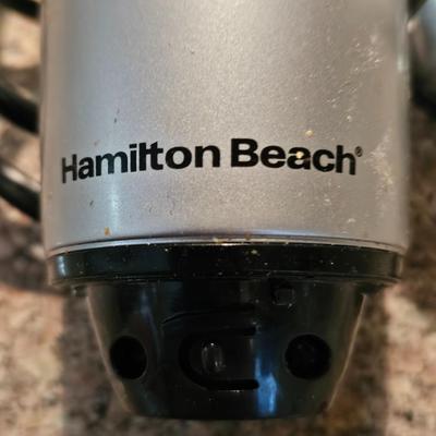 Hamilton Beach drink mixer with an assortment of shot glasses and more