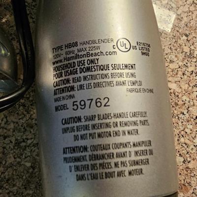 Hamilton Beach drink mixer with an assortment of shot glasses and more