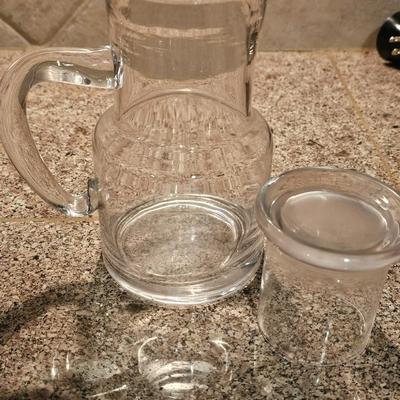 Hamilton Beach drink mixer with an assortment of shot glasses and more