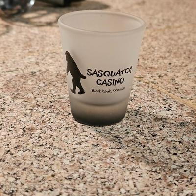 Hamilton Beach drink mixer with an assortment of shot glasses and more