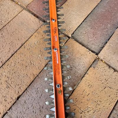 Black & Decker electric weed eater and an electric trimmer with extension cord