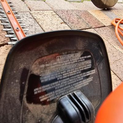 Black & Decker electric weed eater and an electric trimmer with extension cord