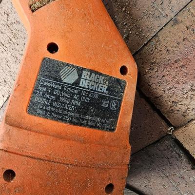 Black & Decker electric weed eater and an electric trimmer with extension cord