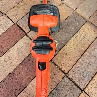 Black & Decker electric weed eater and an electric trimmer with extension cord