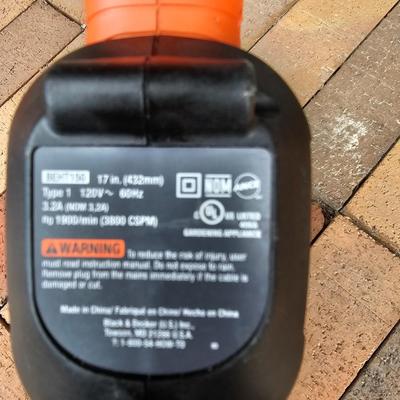 Black & Decker electric weed eater and an electric trimmer with extension cord