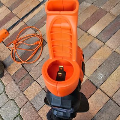 Black & Decker electric weed eater and an electric trimmer with extension cord