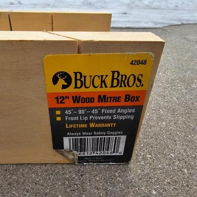 Assortment of hand saws with a wooden Buck Bros. 12" Mitre box