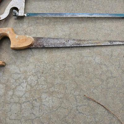 Assortment of hand saws with a wooden Buck Bros. 12" Mitre box