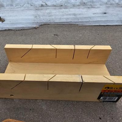 Assortment of hand saws with a wooden Buck Bros. 12" Mitre box