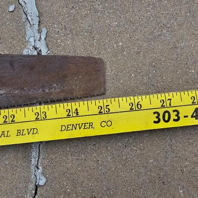 Assortment of hand saws with a wooden Mitre box