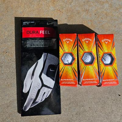 Three new boxes Callaway golf balls and a new pair of dura feel XL gold gloves