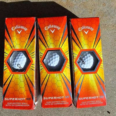 Three new boxes Callaway golf balls and a new pair of dura feel XL gold gloves