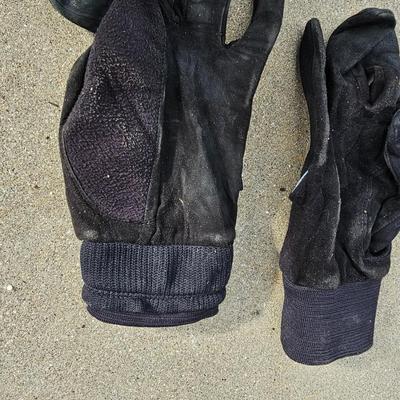 Three new boxes of golf balls and two pair of lightly used gloves