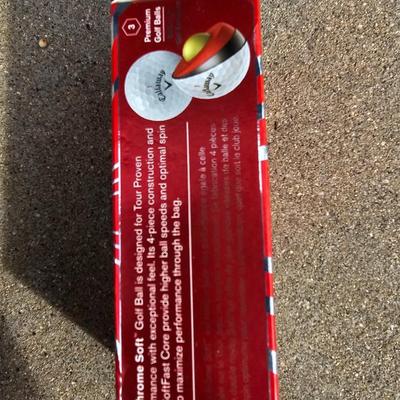 Three new boxes of golf balls and two pair of lightly used gloves