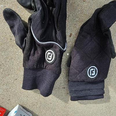 Three new boxes of golf balls and two pair of lightly used gloves