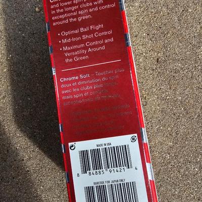 Three new boxes of golf balls and two pair of lightly used gloves