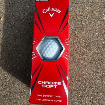 Three new boxes of golf balls and two pair of lightly used gloves