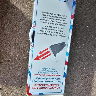 Three new boxes of golf balls and two pair of lightly used gloves