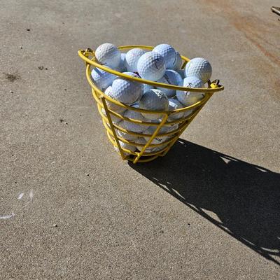 Golf balls in heavy metal golf ball range basket 2 of 4