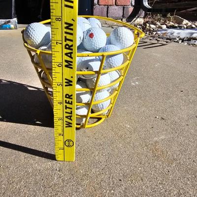 Golf balls in heavy metal golf ball range basket 2 of 4