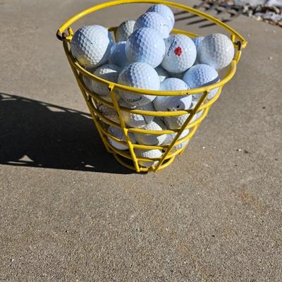 Golf balls in heavy metal golf ball range basket 2 of 4