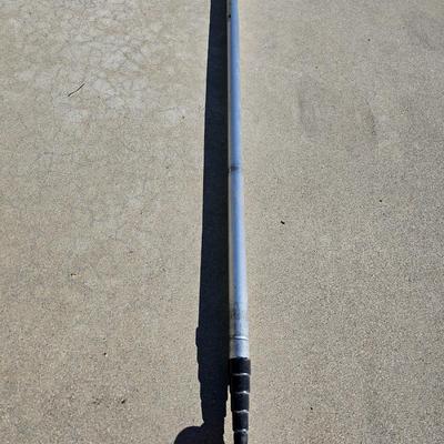 Colored Golf balls in smaller heavy metal golf ball range basket with a golf ball grabber