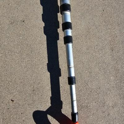 Colored Golf balls in smaller heavy metal golf ball range basket with a golf ball grabber