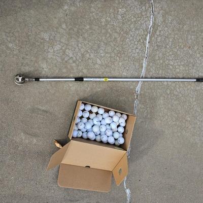 Golf balls with advertisements and a ball grabber