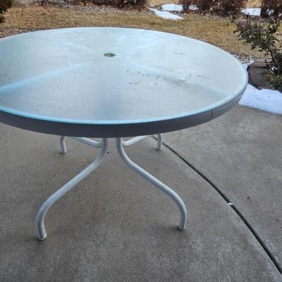 Outdoor patio table with 4 cushioned chairs