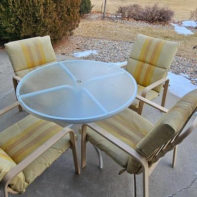 Outdoor patio table with 4 cushioned chairs